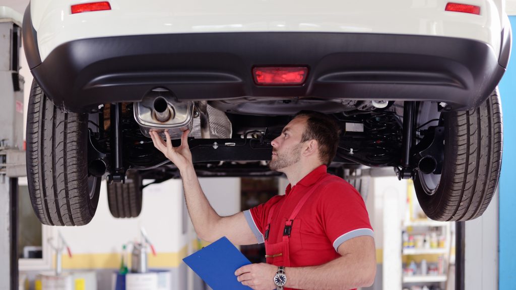 auto repair franchise opportunity - mechanic have inspection of car